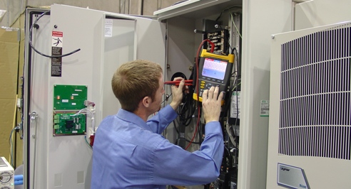 Purcell Systems technical field-expert tests integration of telecommunications equipment